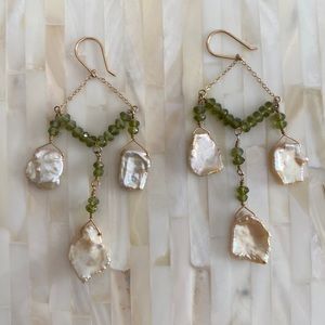 Shell drop earrings with green stones.